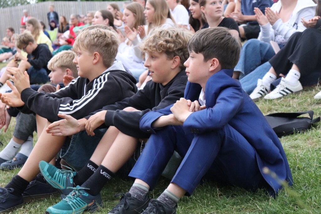 A group of students watching the performances