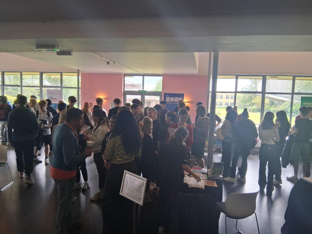 Students networking and chatting to staff