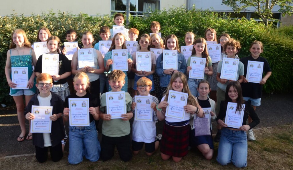 A group of pupils with their certificates