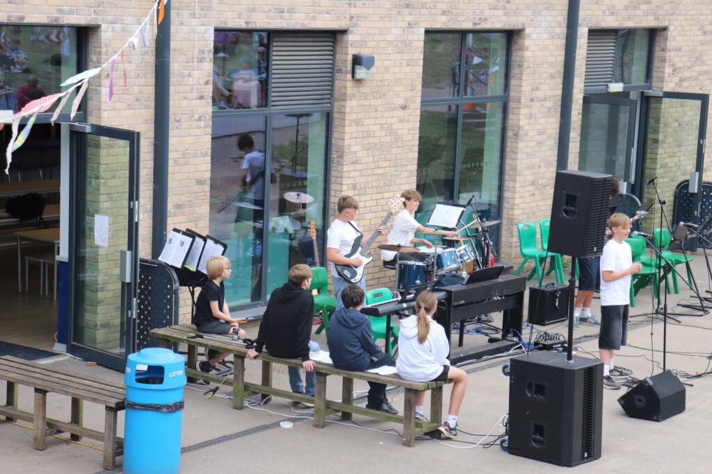 A group of students performing with instruments