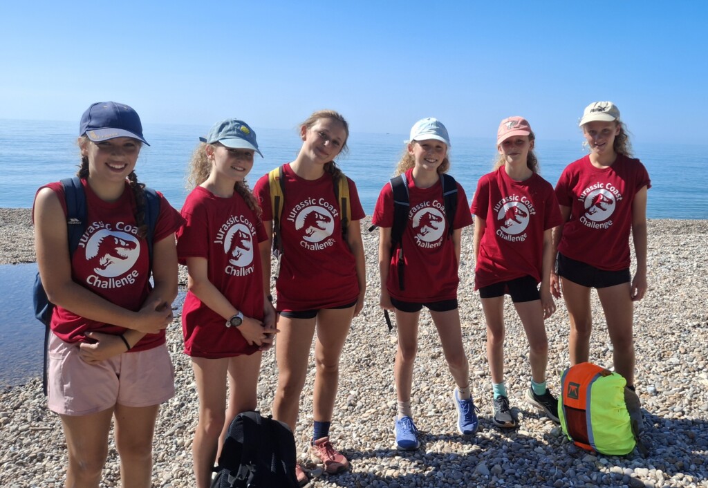 a group of pupils in their red Jurassic Coast Challenge t-shirts