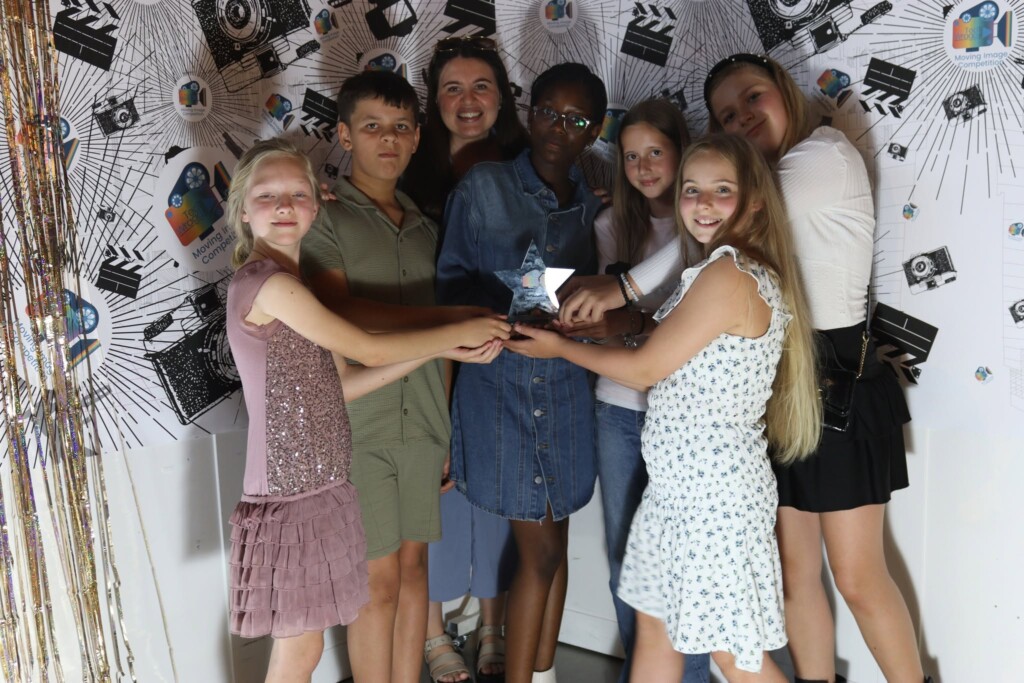 One of the winning teams posing with their trophy