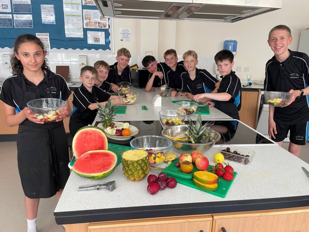Students with their fruit salad creations