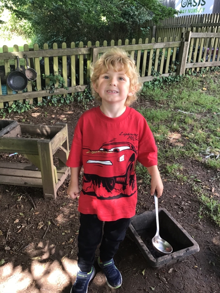 A pupil holding a big spoon
