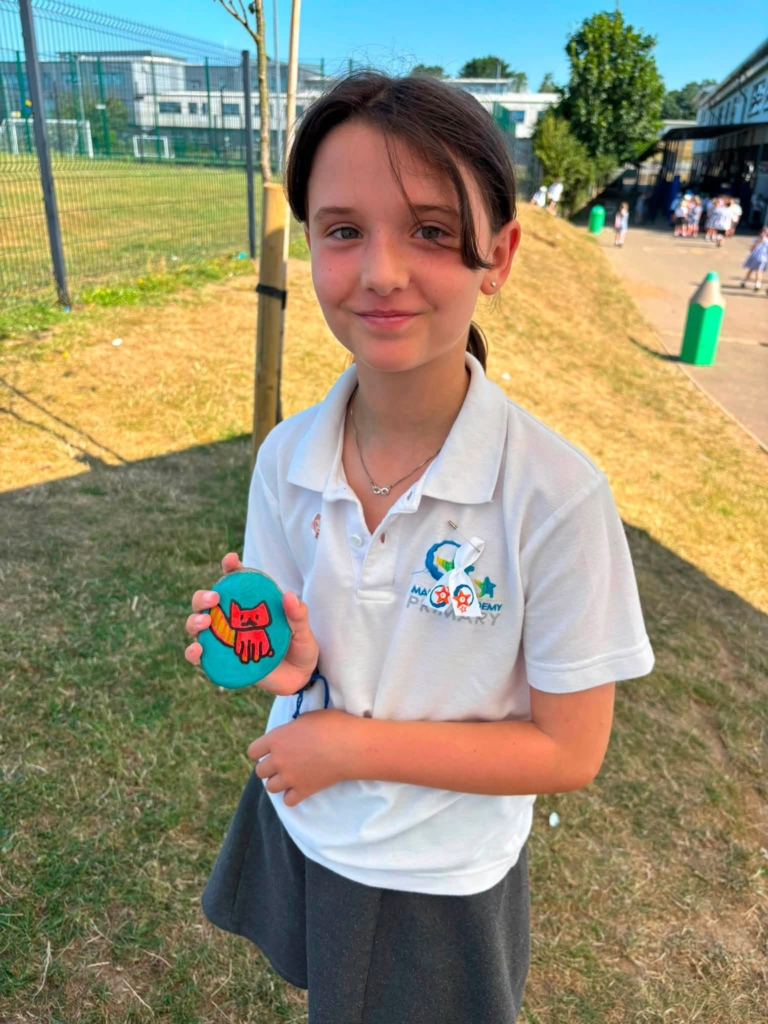 A pupil with a decorated stone