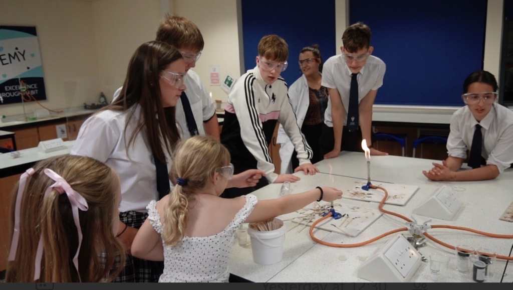 Students and visitors learning about Bunsen Burners