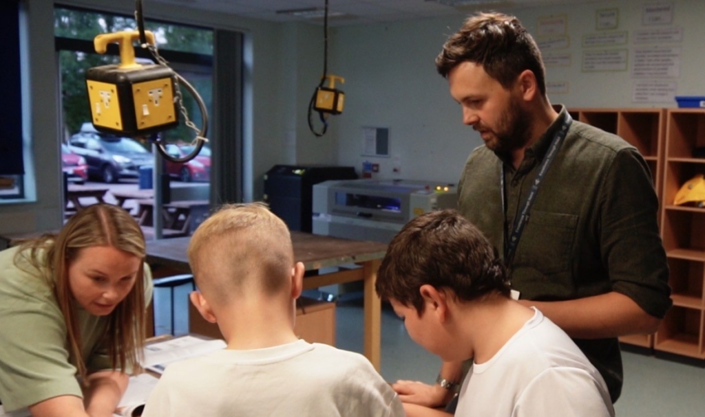Visitors exploring the tech department