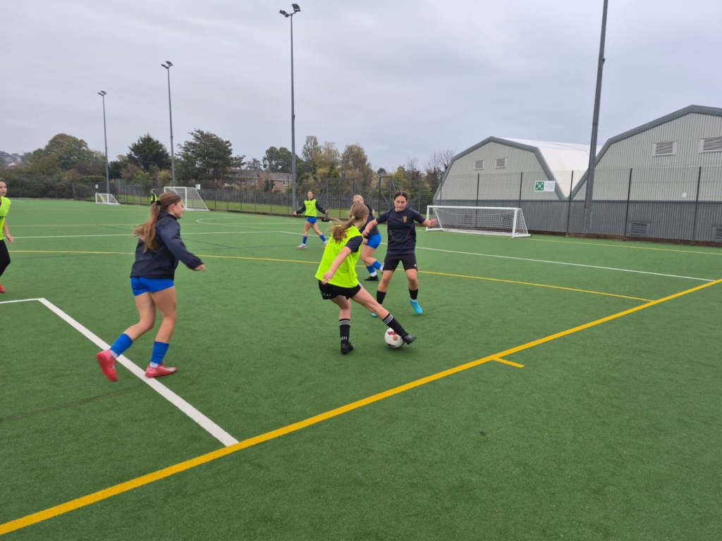 Girls playing football